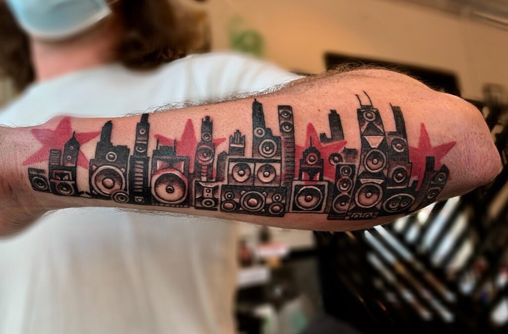 Chicago skyline tattoo, speaker skyline tattoo, Chicago skyline best tattoo, Speakeasy Custom Tattoo, Best Chicago tattoos